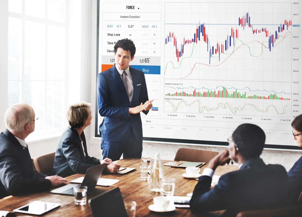 A man in a suit is giving a presentation